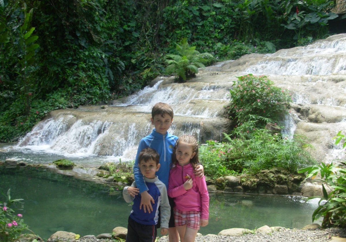 three children visiting Konoko Gardens and Waterfalls St Anne's Parish Jamaica