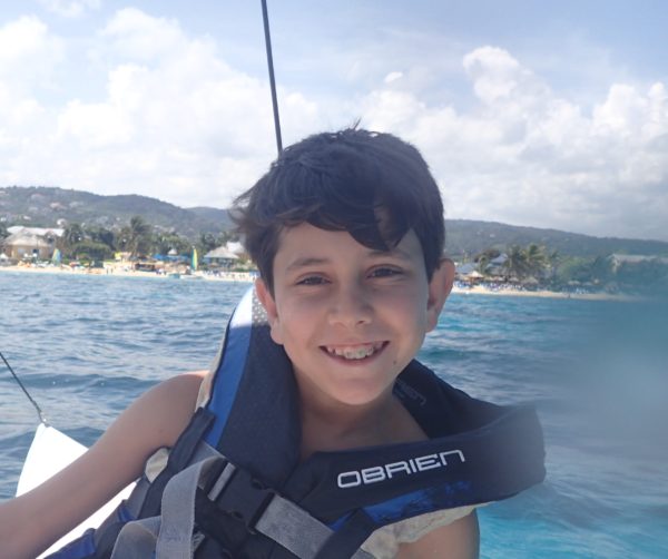 Caiden on boat in Jamaica