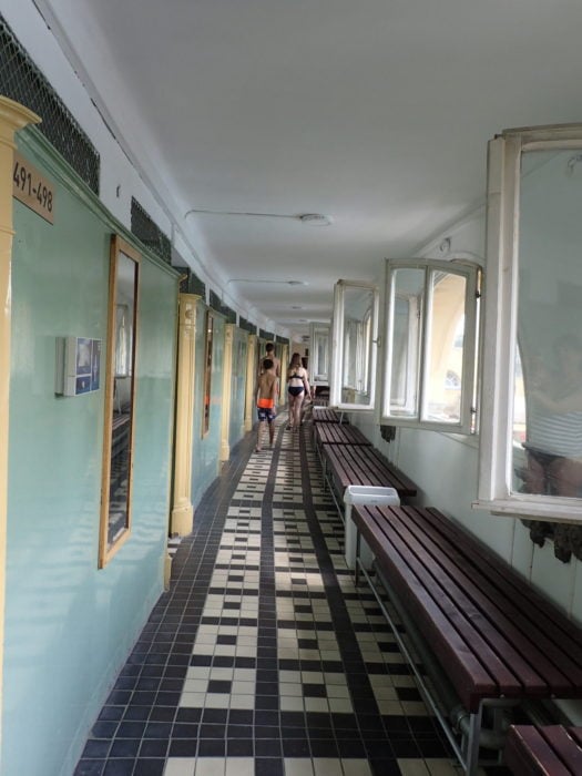 image of hallway at Szechenyi Baths with black and white floor and windows to the right