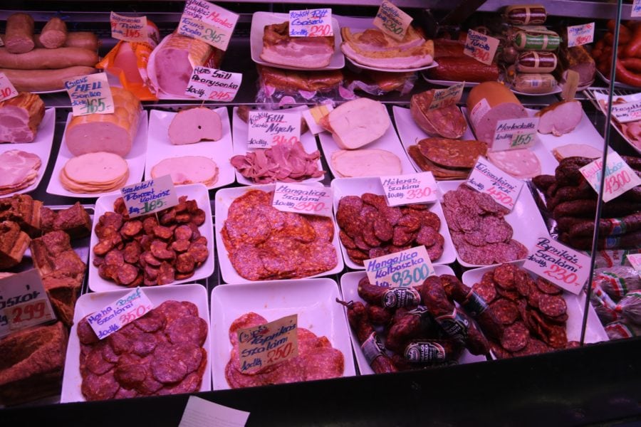 image of display cabinet with variety of meats and sausages