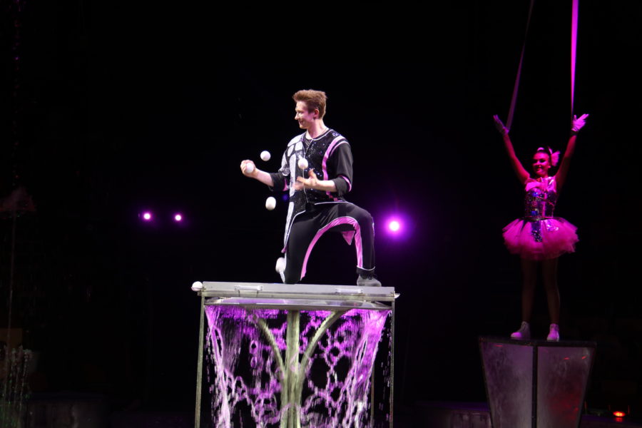 image of male juggler with several balls
