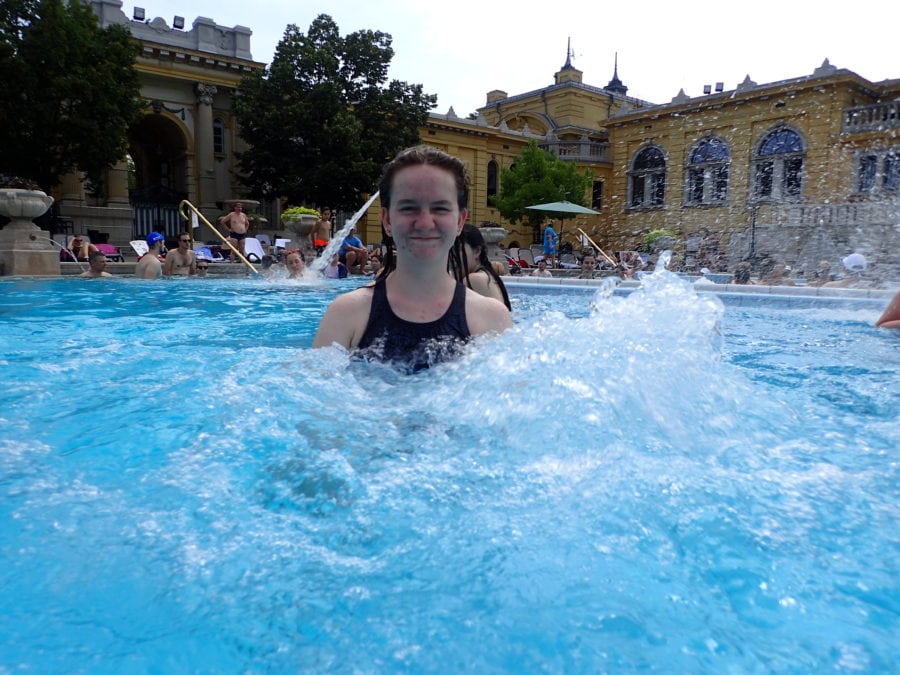 Sydney standing on water jets in the cooler pool at Szechenyi Baths