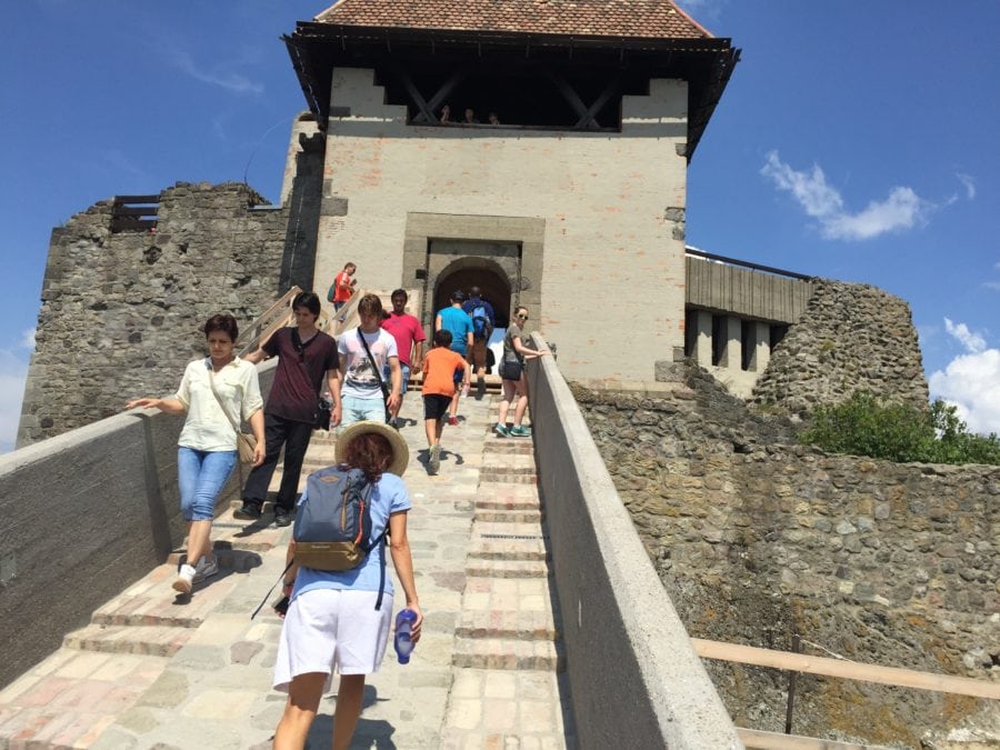 image of us walking up ramp to castle on day trip from Budapest