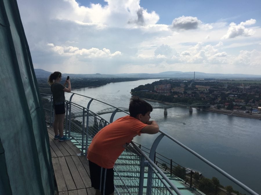 image of my kids looking out over railing on top of cupola taking pictures