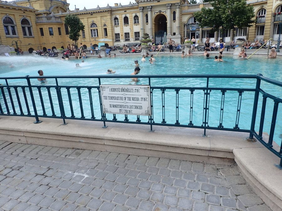 a white sign stating the pool temperature of 38 degrees of the warm pool at Szechenyi Baths