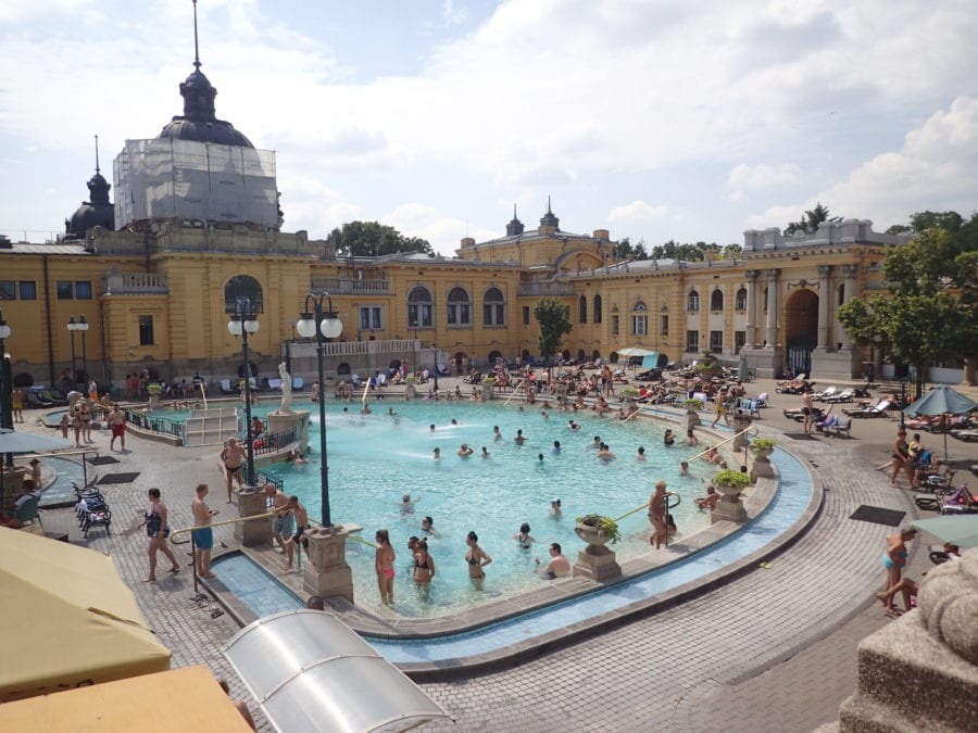 image of the hottest outdoor pool at Szechenyi Baths showing many people in the steaming water