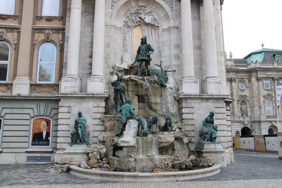large fountain with hunters, deer and hunting dogs