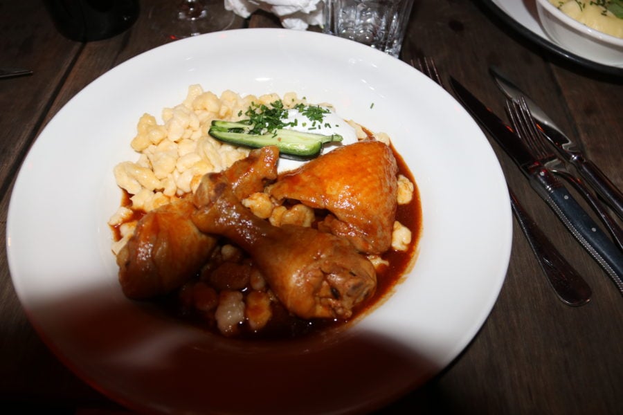 chicken papricash on plate with spaetzle is must try Budapest food