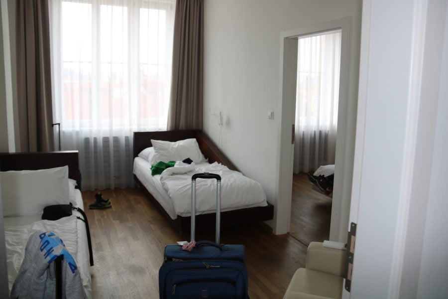 image of two single beds in bedroom in Prague family apartment