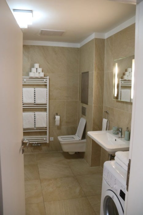 image of large bathroom with washer and dryer