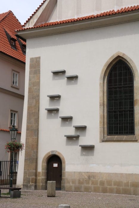 image of the side of the chapel showing 8 staggered one foot long shelves