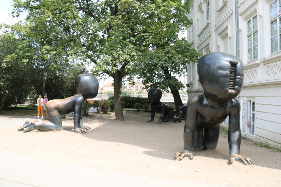 image of David Cerny's very large iron babies with no face, just a bar code