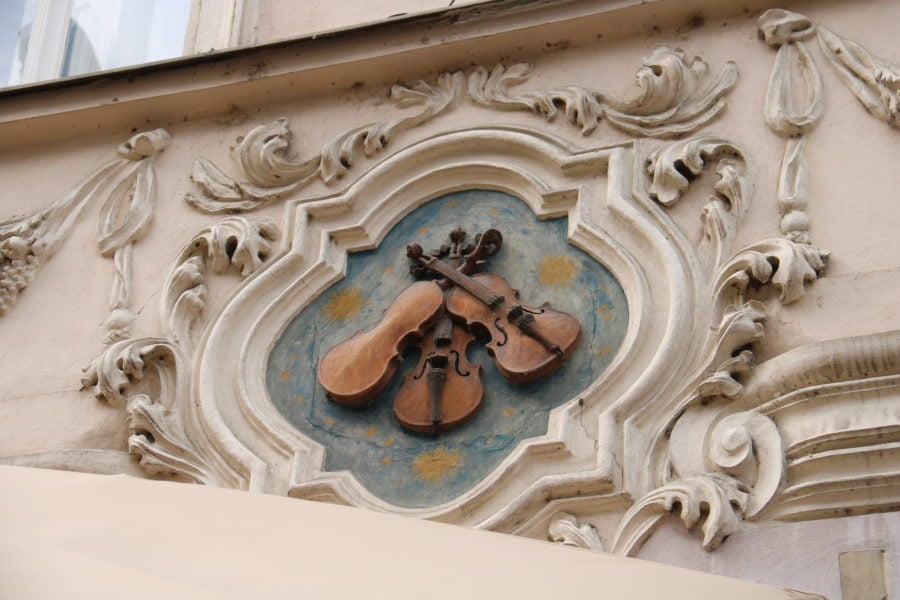 image of three violins with bows crossing Nerudov U Prague