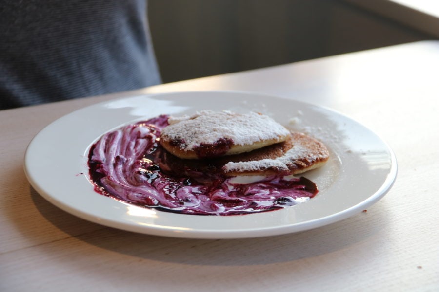 image of two pancakes with berry syrup is an amazing sweet Czech food or dessert