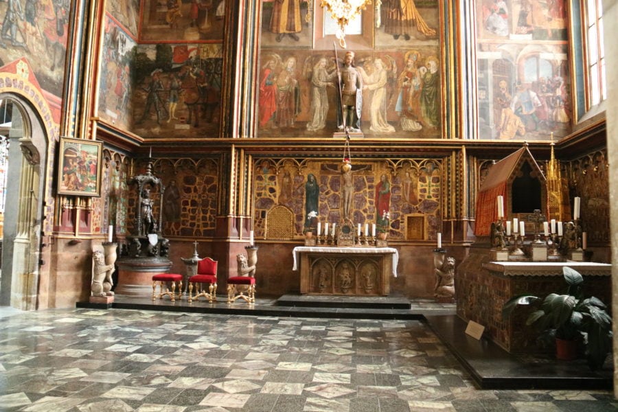 image of fresco painted colourful room with tomb to the right