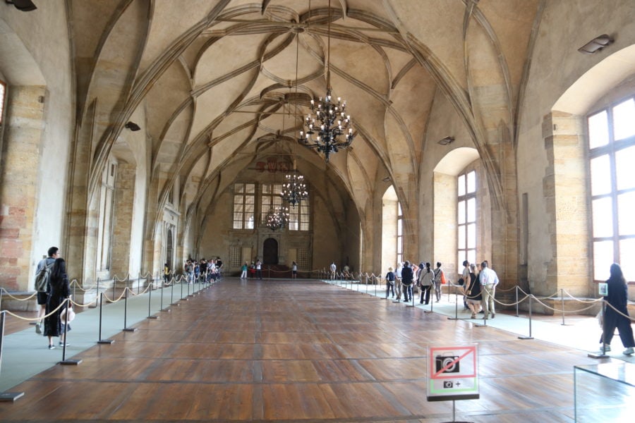 image of large room with arched ceilings and hardwood floors