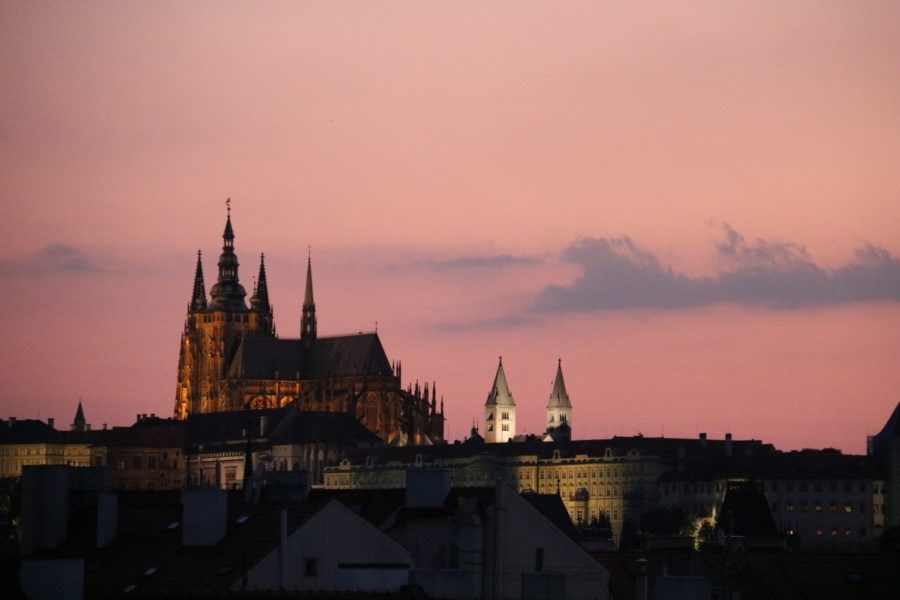 image of St Vitus with pink sky from balcony at Prague family apartment 