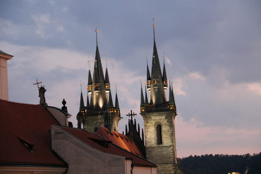 image of towers of Tyn church lit up at night