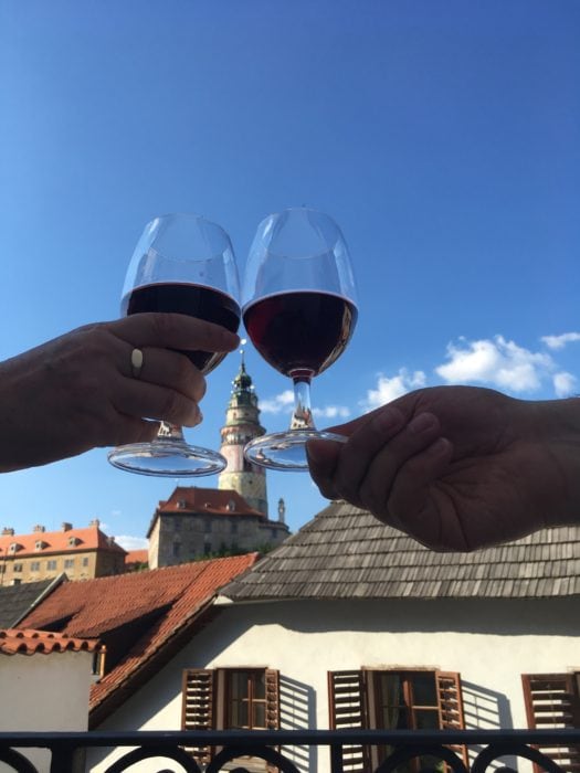 image of two wine glasses with castle behind 