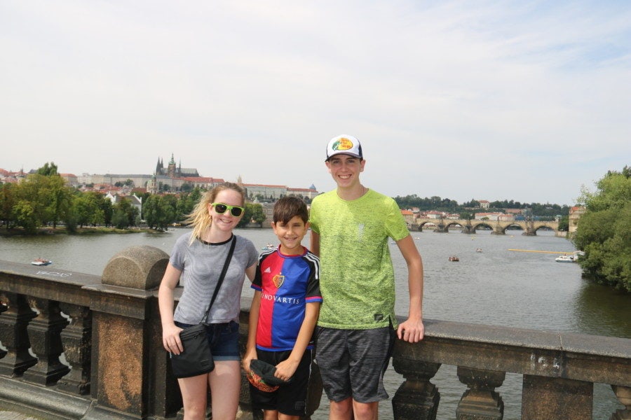 image of the kids with Vitus cathedral in background during 3 days in Prague