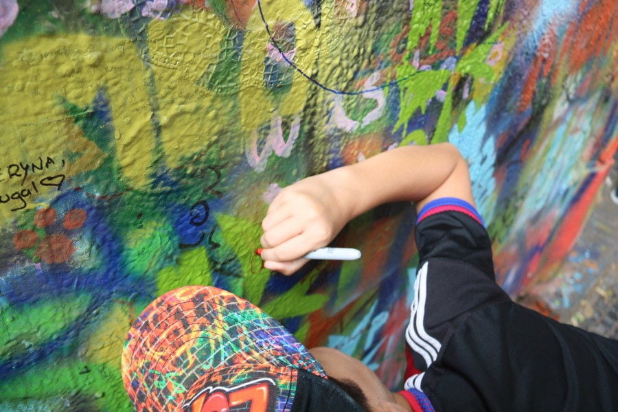 image of caiden drawing on wall