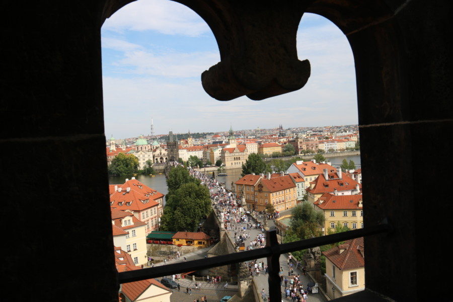 image of charles bridge through a keyhole Prague itinerary day 2 of 3 days in Prague