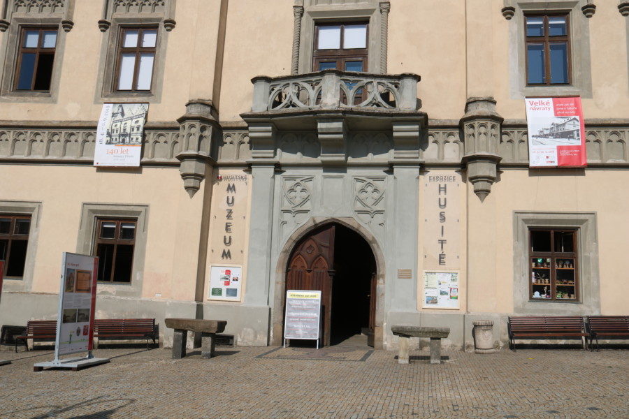 image of peach building with hussite museum printed on each side of the double door