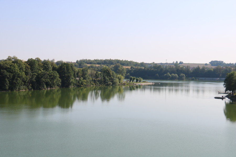 image of river in Tabor with bright green trees along the side