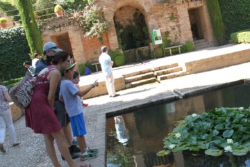 image of Caiden and Sydney with private guide by lily pond
