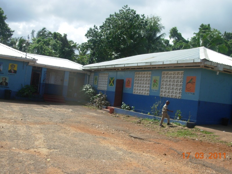 image of blue school on a hill