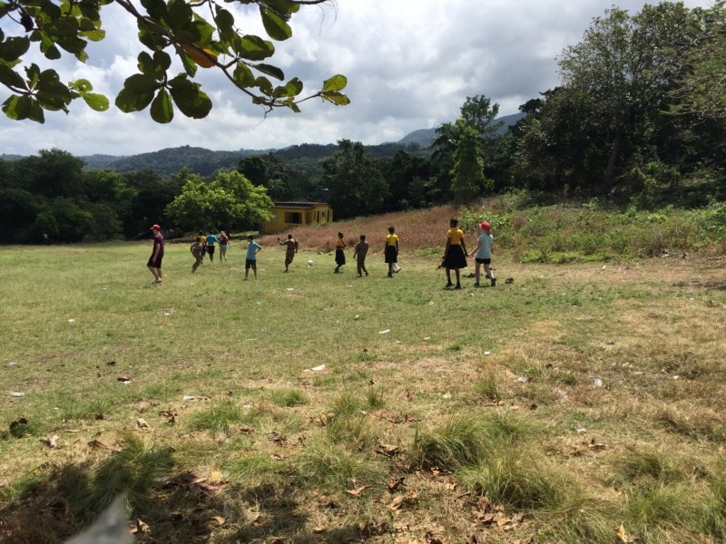 image of back field of Jamaica school during visit with Jamaican children