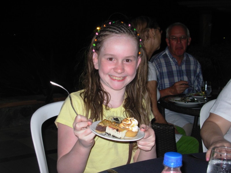 sydney with hair in braids holding plate of desserts at Jewel Runaway Bay