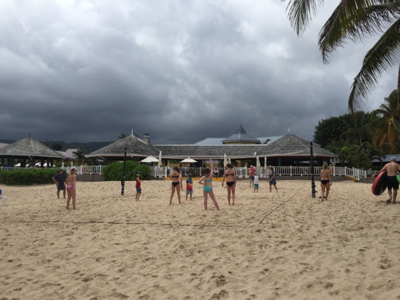 Kids on large beach playing volleyball at Jewel Runaway Bay