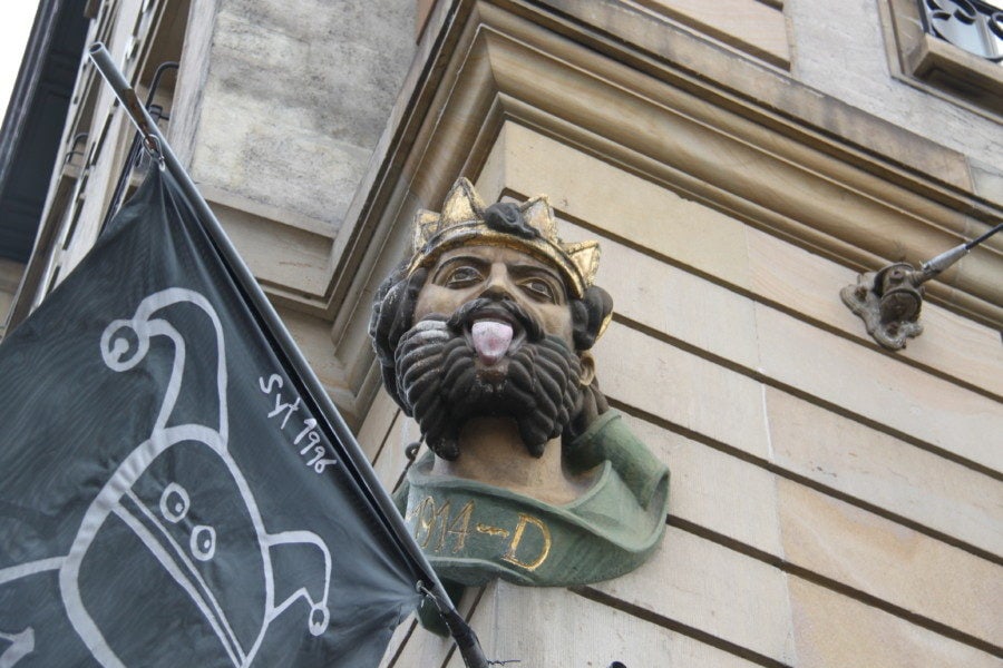 image of different king with tongue sticking out on corner of building in Basel