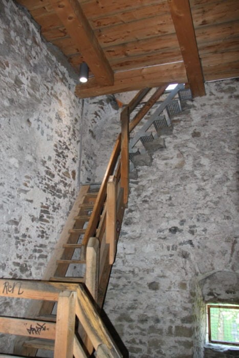 wooden stairs inside Lucerne wall tower during one day in Lucerne