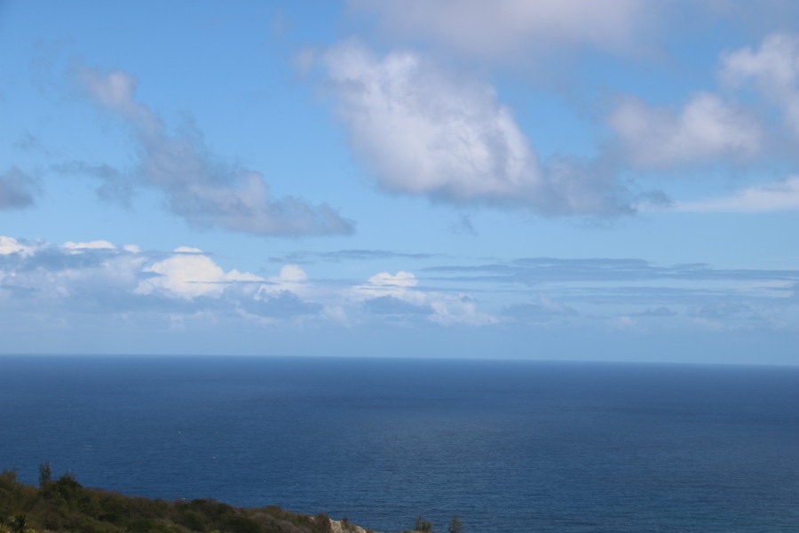 distant view of Atlantic ocean with white clouds picture of Barbados 