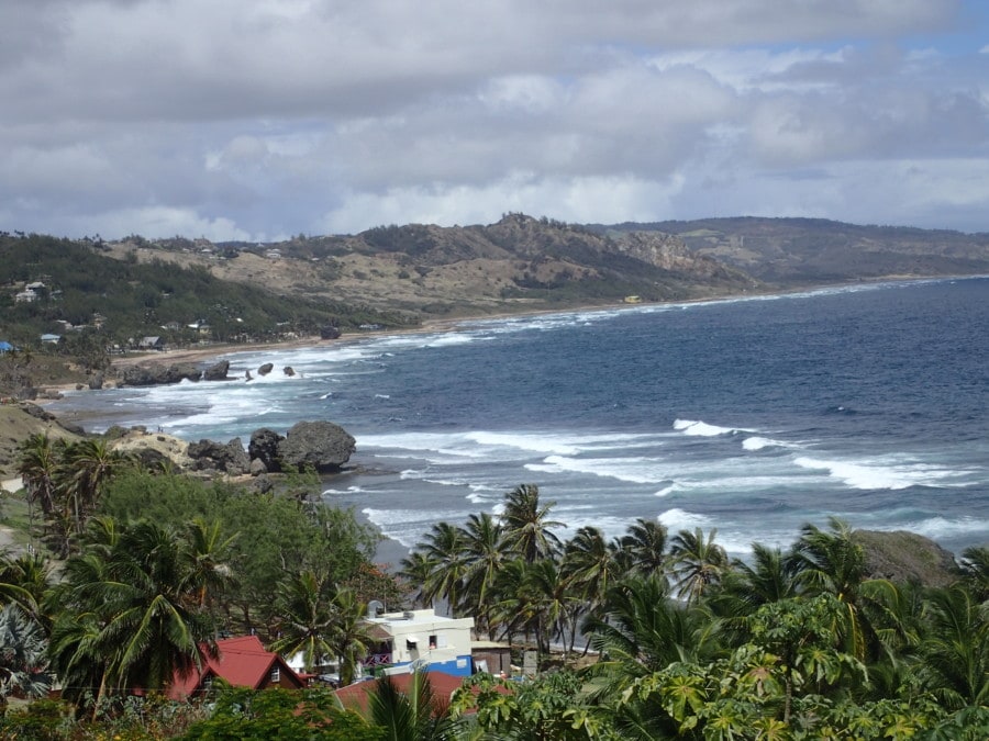 Bathsheba in the distance with large rocks and crashing waves Barbados attraction