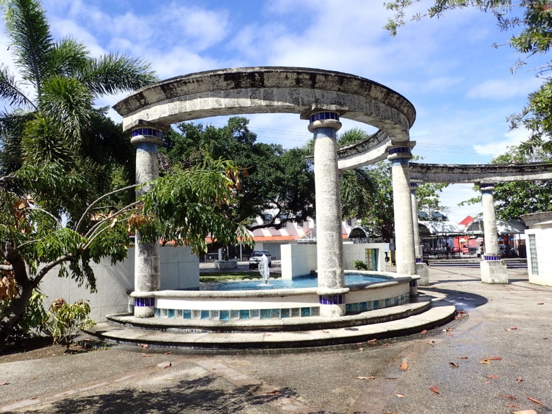 circular fountain with stone pillars is Barbados Attraction in Independence Park Bridgetown