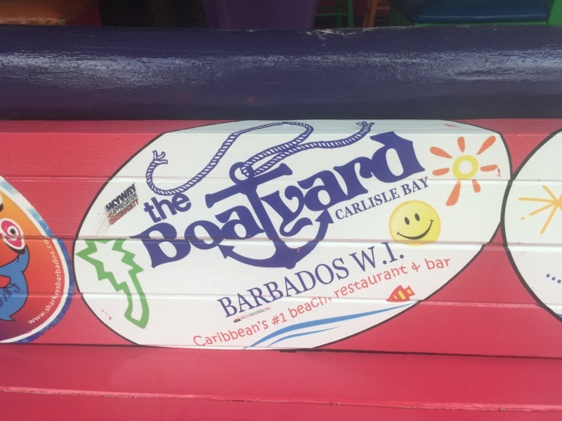 The boatyard sign in red with blue logo Barbados Attractions