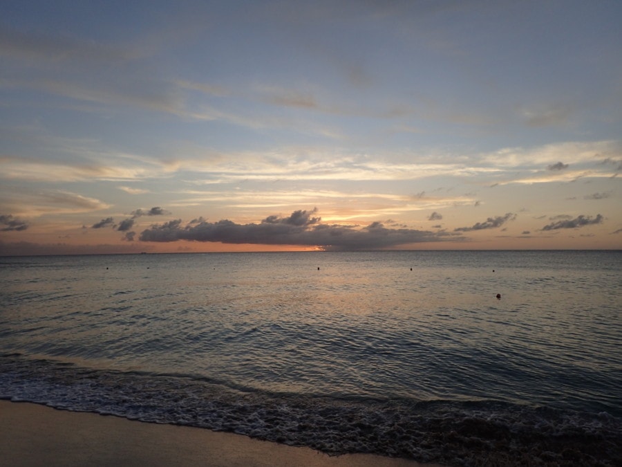 beach, Caribbean sea and blue and pink sky at sunset