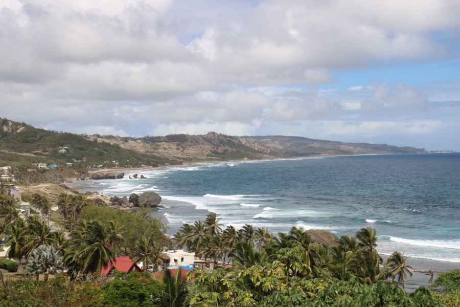 distant view of cove with massive rocks in shallow waters is Bathsheba and one of most instagrammable locations in Barbados