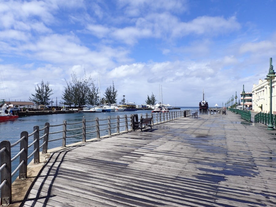 boardwalk at marina with green fencing 