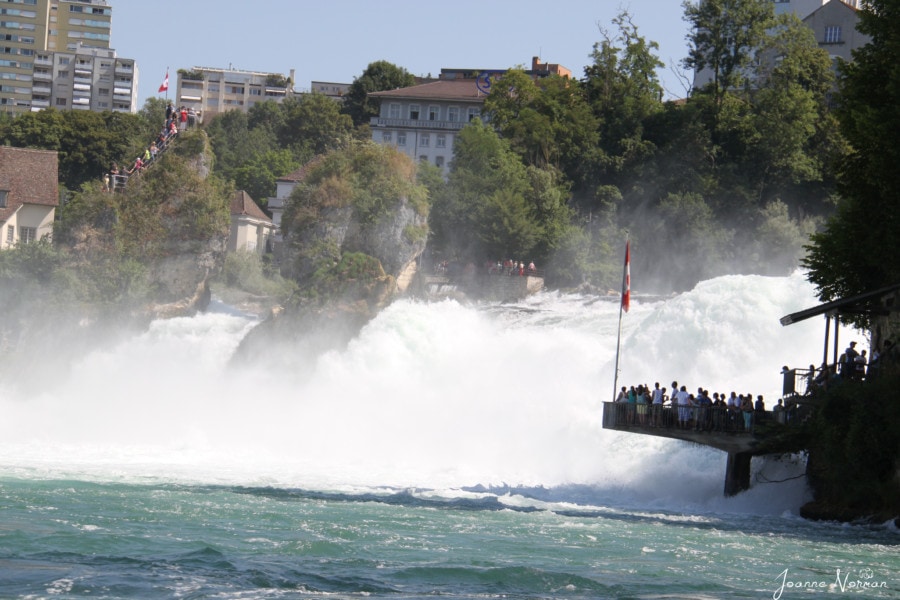 view of crashing water from Rheinfall right next to viewing platform
