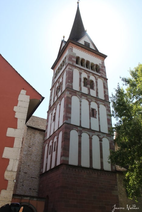 tall rectangle tower with pointed steeple white with orange trim in Schaffhausen