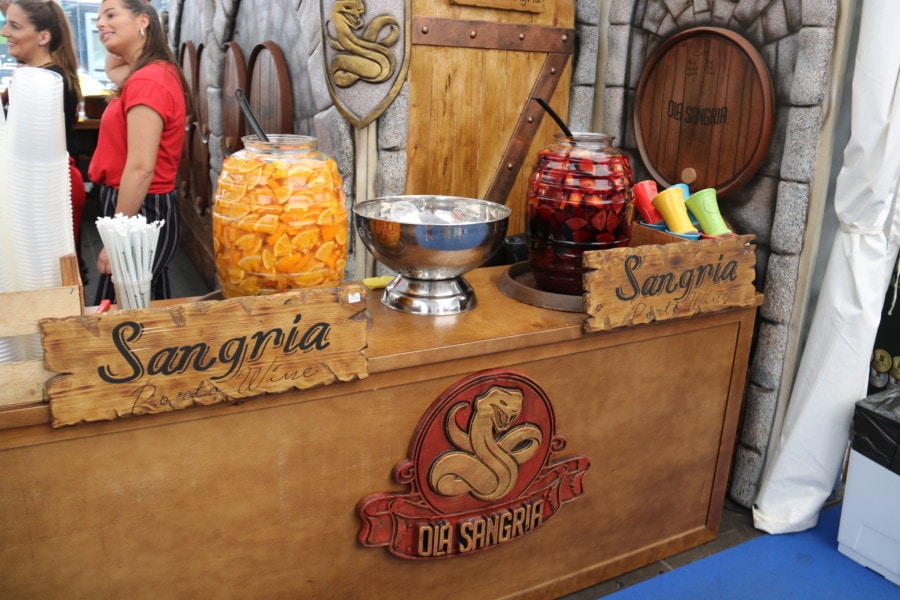 wooden booth with Sangria carved on it and sangria on top