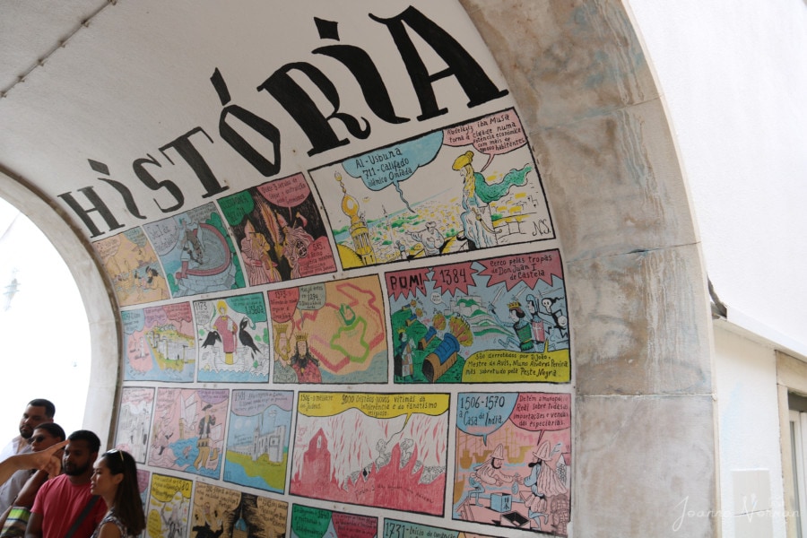 cartoon comic books style on wall is great thing to do in Alfama with kids