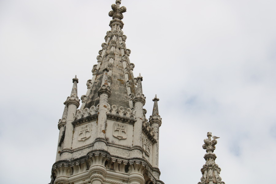 a white decorative lacy like steeple atop the Santa Maria de Belem church