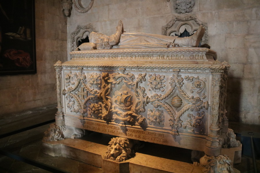 white stone casket with ship on front and lions below and Vasco de Gama on top as seen on a day in Belem