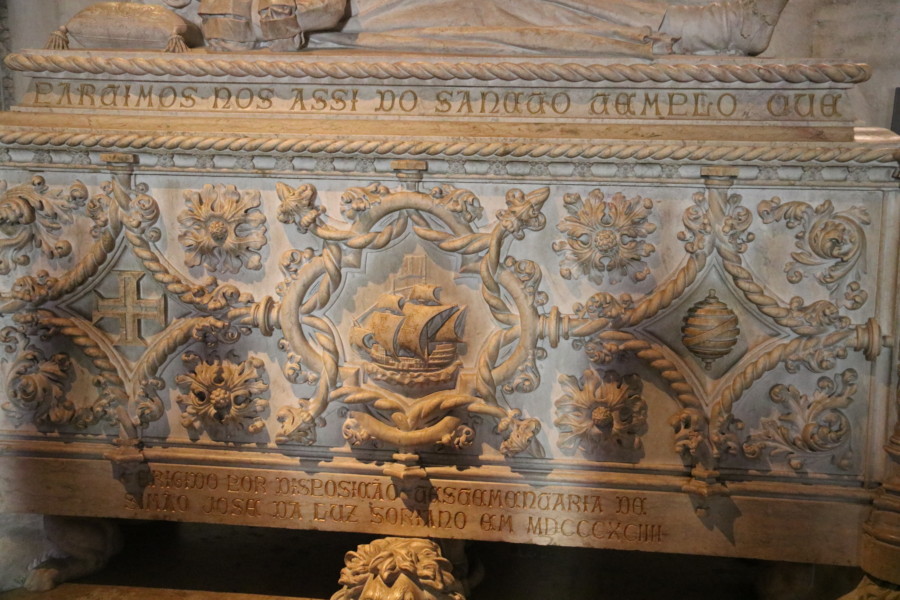 close up of decoration on the casket of Vasco de Gama showing templar cross sailing ship and armillary sphere