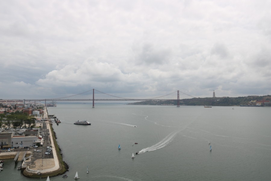 view from the top of the monument showing Tagus River, Abril 25 bridge and Christ statue
